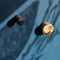 Textured brass and steel knobs