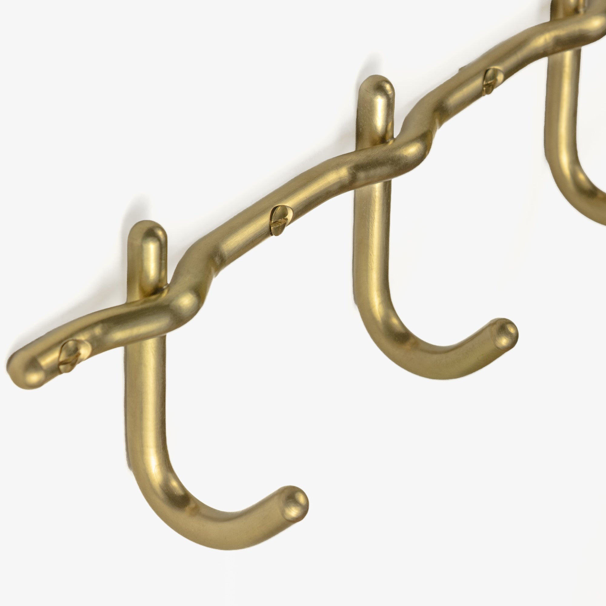 Brass hook rail mounting detail