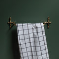 Hand-finished unlacquered brass hand towel bar, made in Vancouver