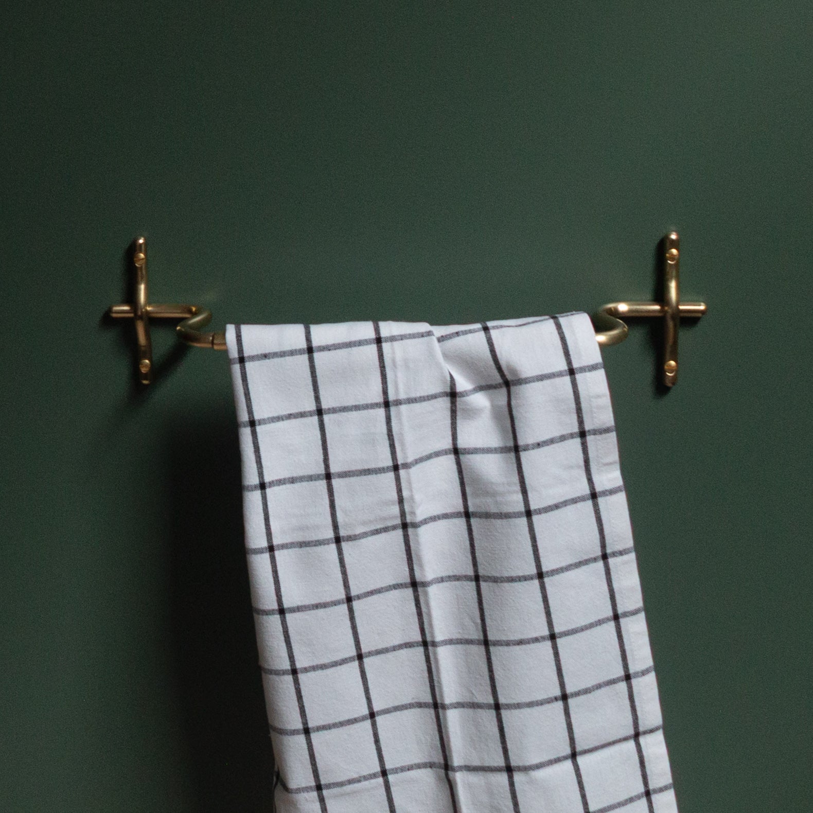 Hand-finished unlacquered brass hand towel bar, made in Vancouver