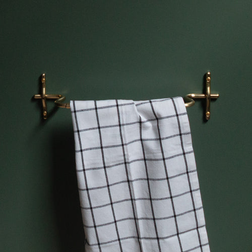 Hand-finished unlacquered brass hand towel bar, made in Vancouver